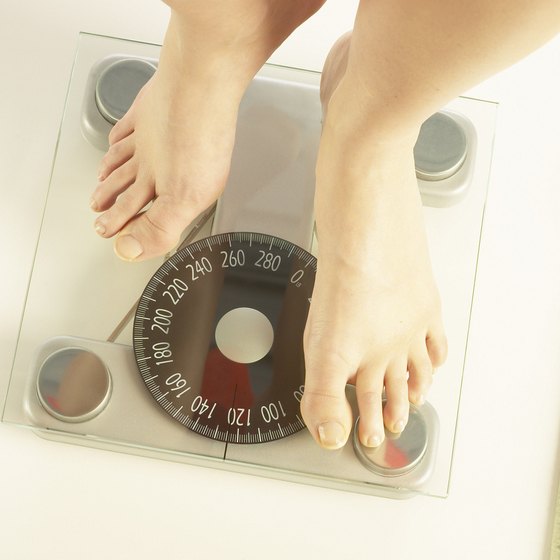 You can calculate your total fat mass from your weight and lean body mass.
